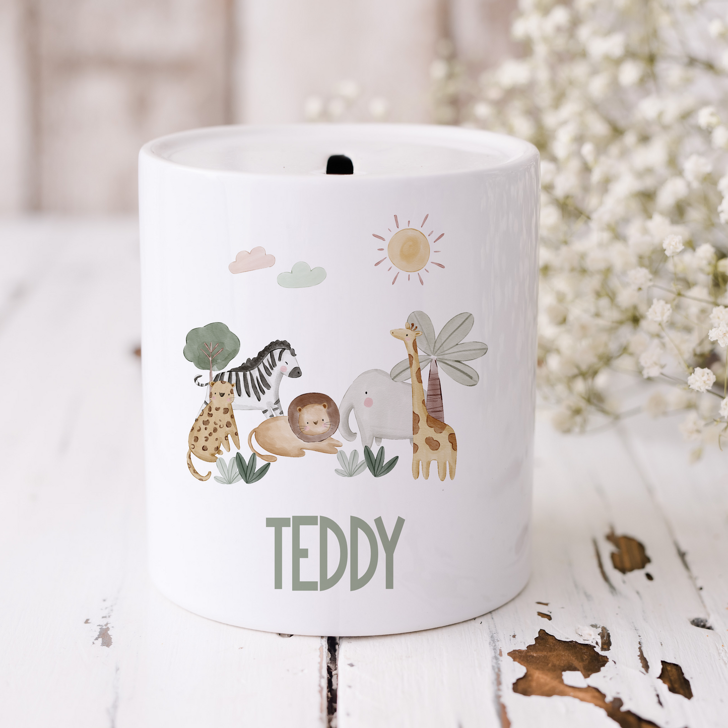 a white cup with a picture of a giraffe and a zebra on it