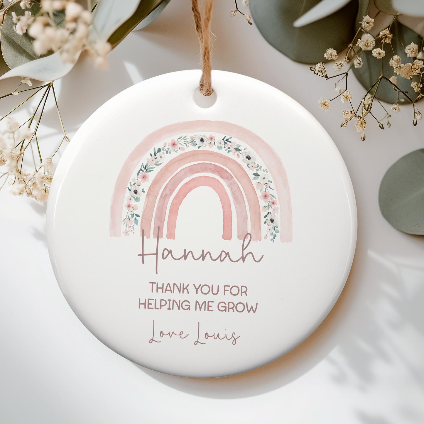 a ceramic ornament with a rainbow on it
