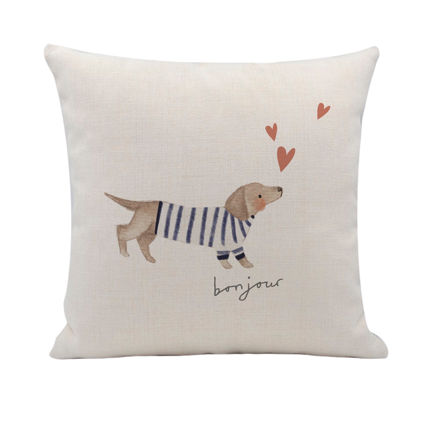 a pillow with a dog wearing a sweater