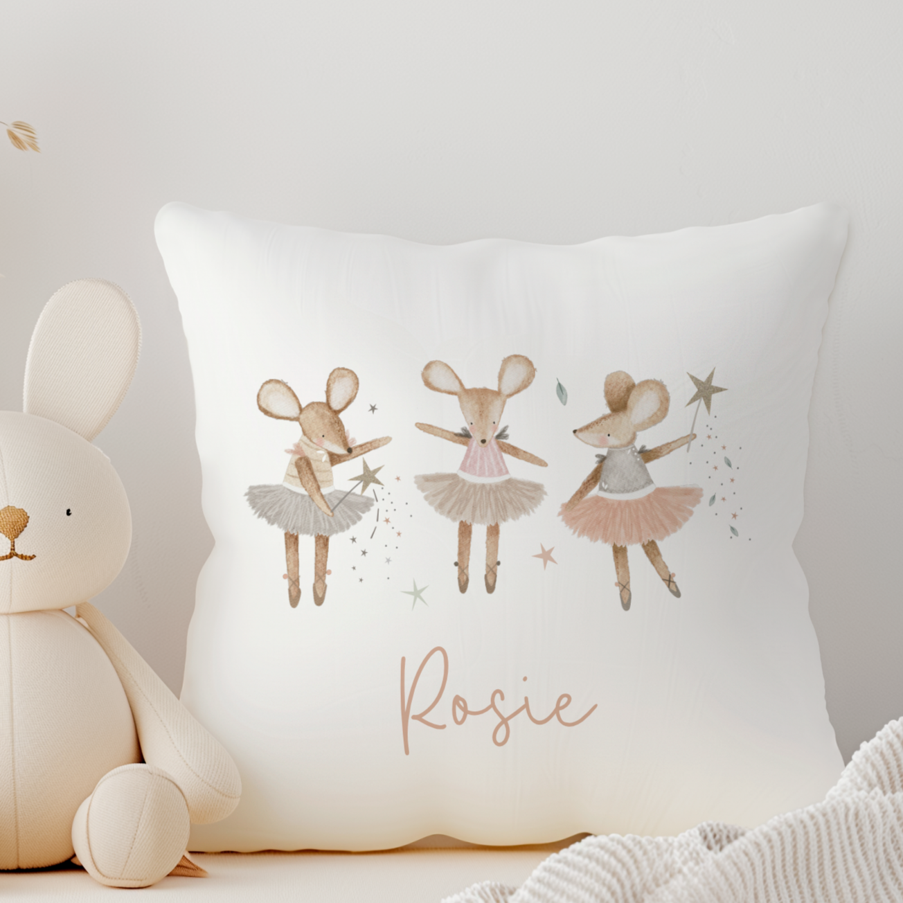 White canvas cushion with triple mouse ballerina illustration. Personalised with name in peach coral script font.