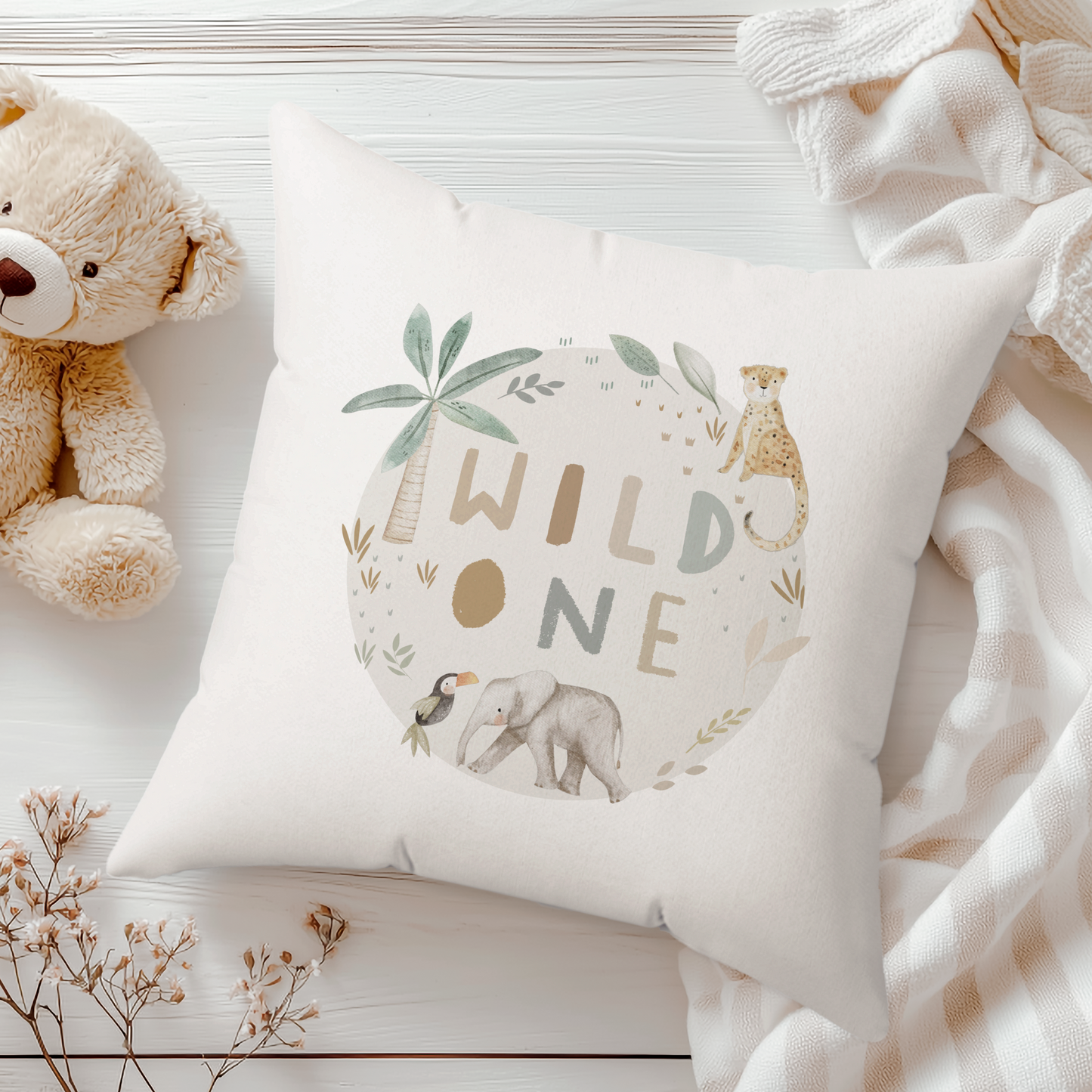 a teddy bear and a pillow on a white table