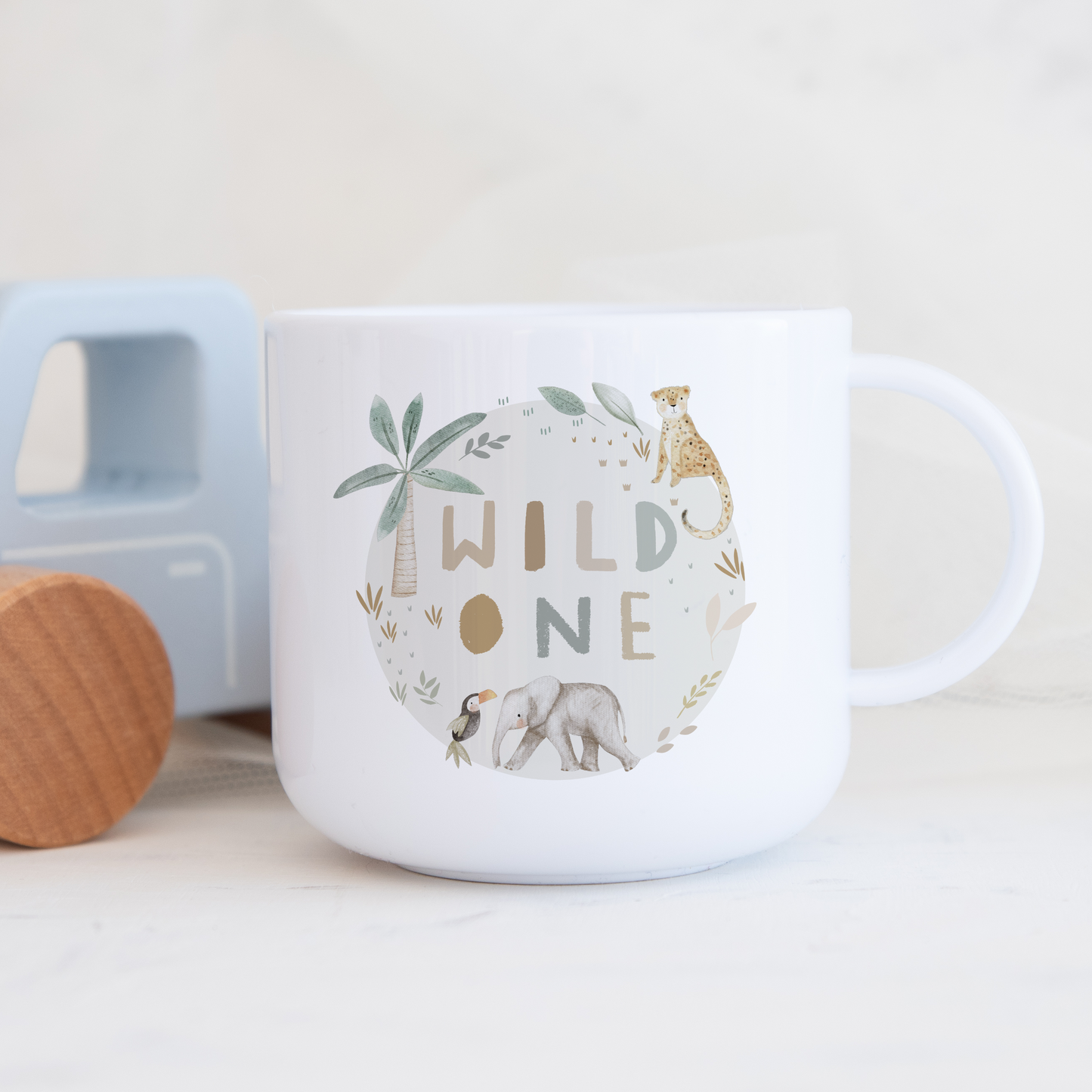 White polymer childs mug with wild one illustration in a circle of jungle safari animals