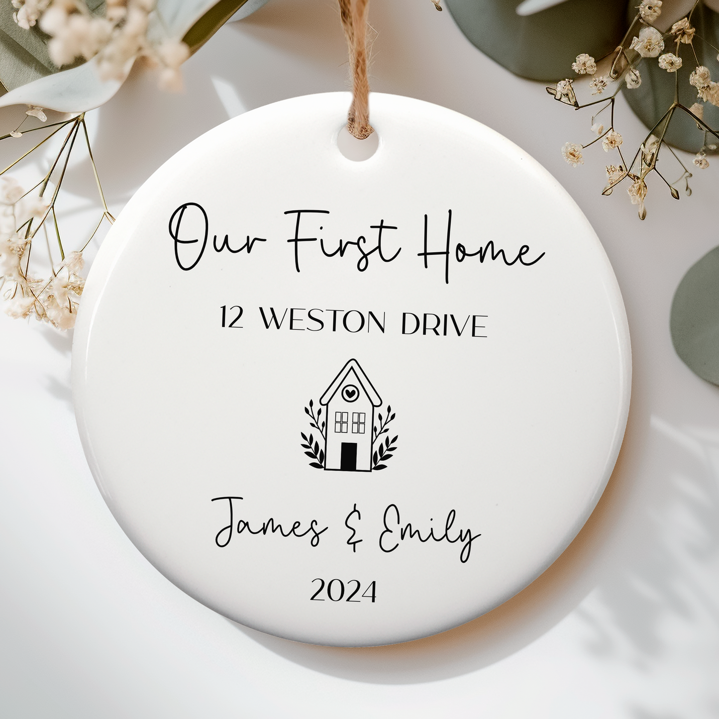 white ceramic ornament for first home, personalised with name and year with cute house doodle underneath