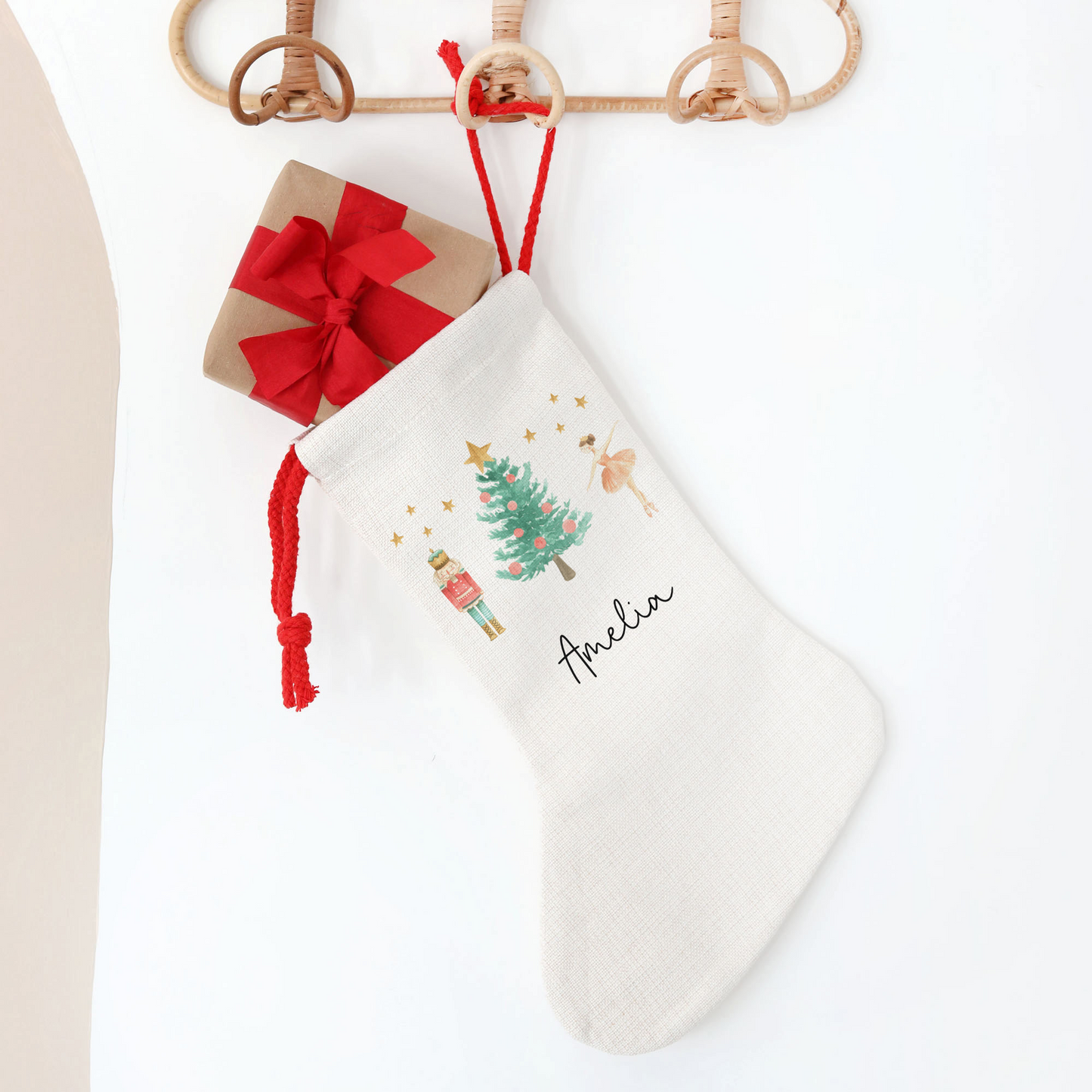 Off white linen stocking with nutcracker and sugar plum fairy design
