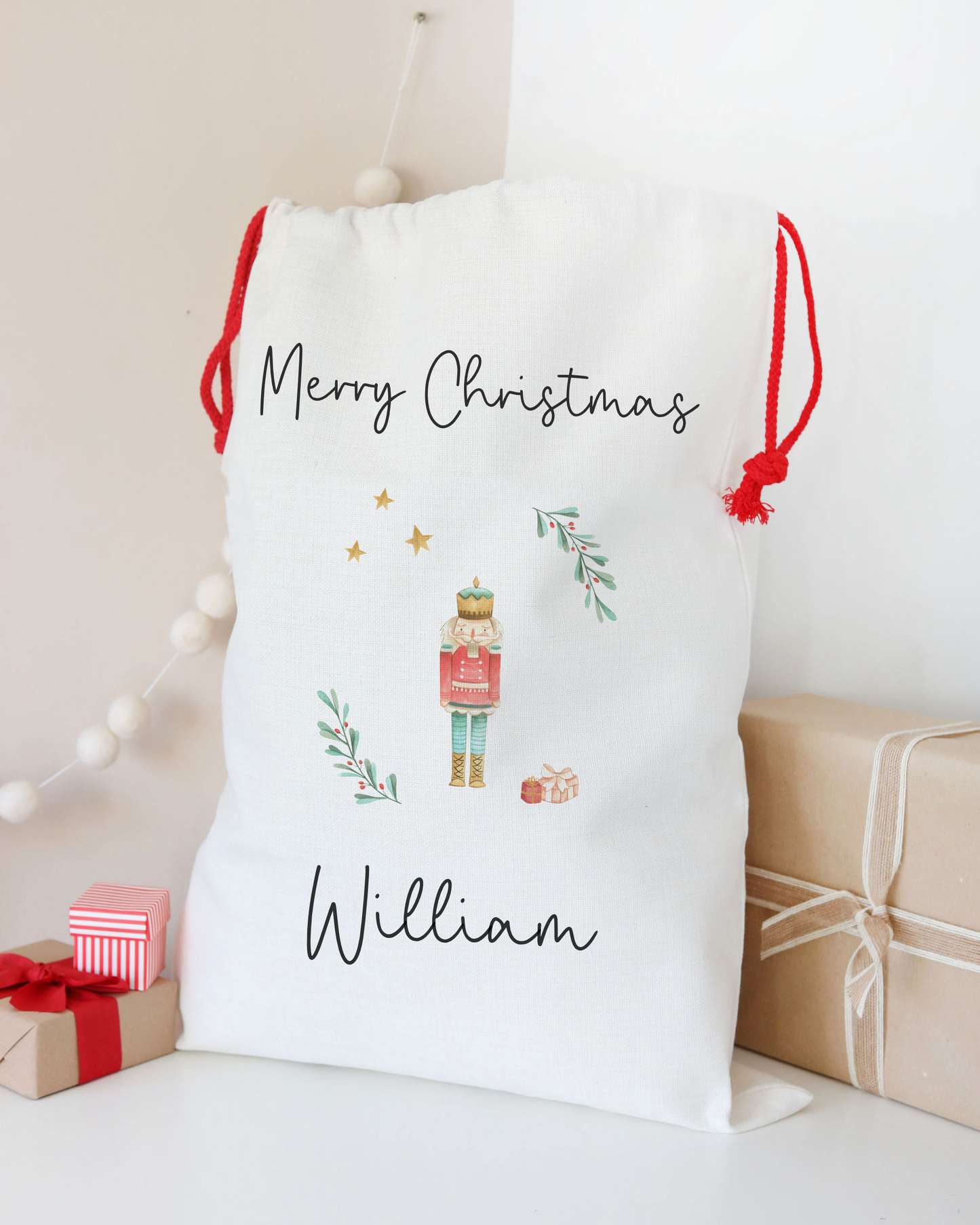 White Christmas stocking with 'Merry Christmas' and 'William' text, surrounded by festive decorations.