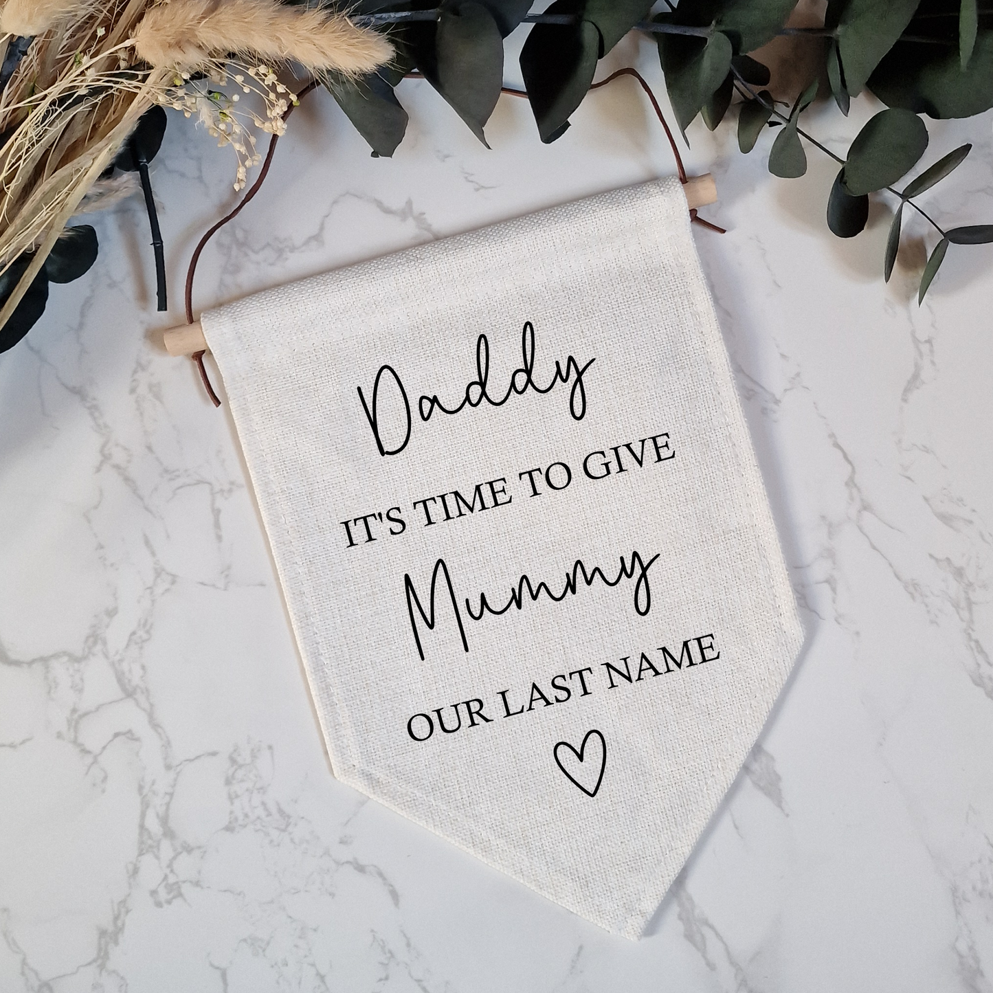 a white banner with the words daddy it's time to give mummy our last