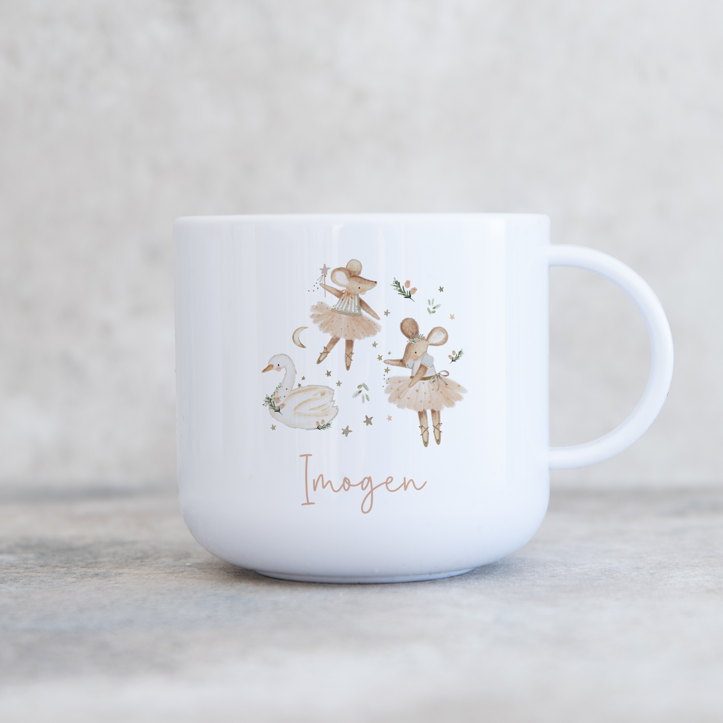 White mug with festive mice design and 'Imogen' text on a light background