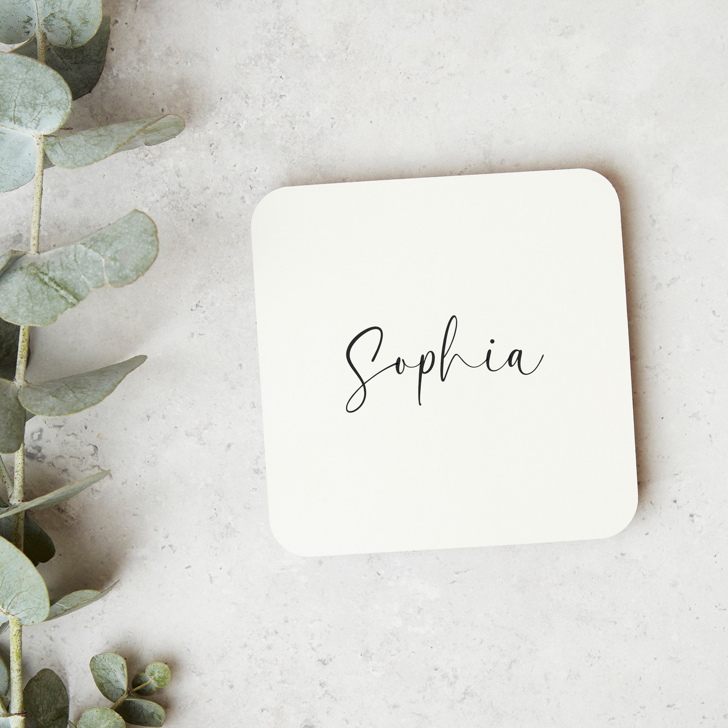 a square coaster with the word saphlia written on it