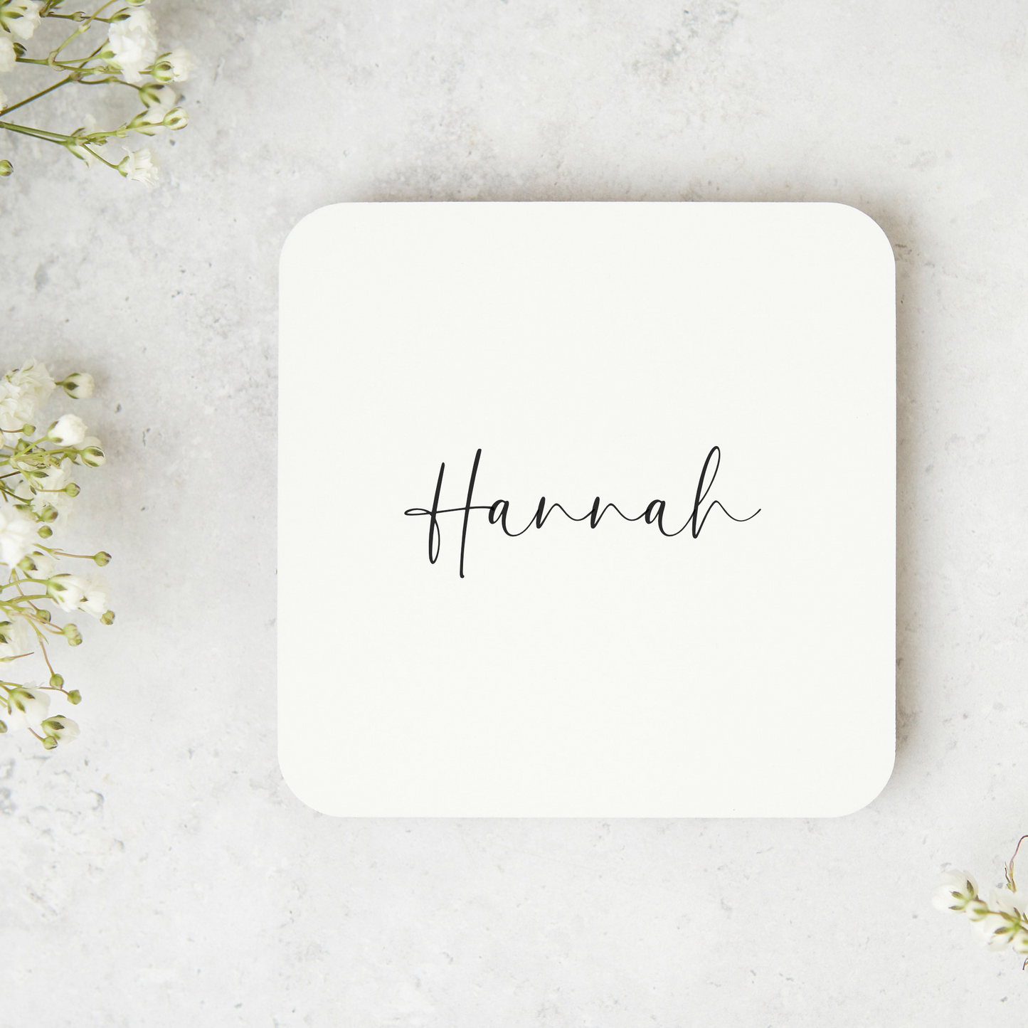 a coaster with the word hannah written on it