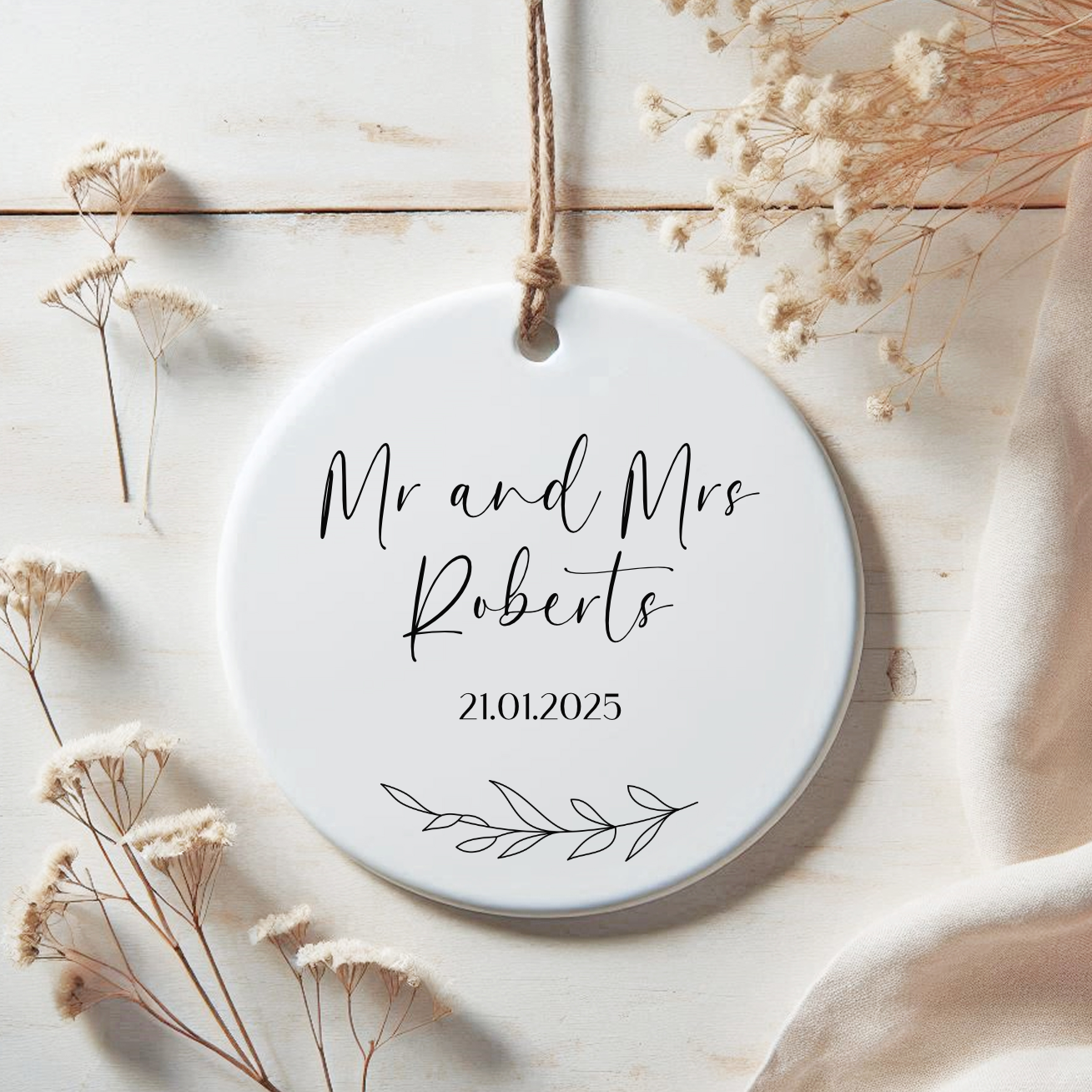 a white ceramic ornament with the words mr and mrs robert written on it