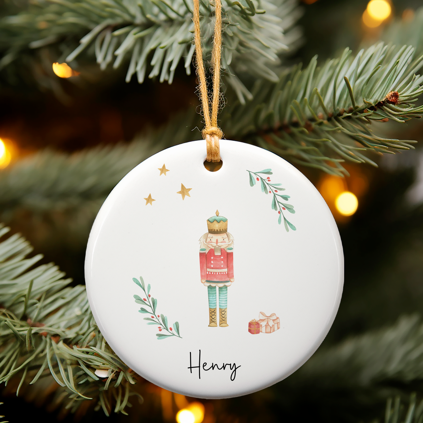 Ceramic ornament with Nutcracker illustration. Personalised with name in black script font.
