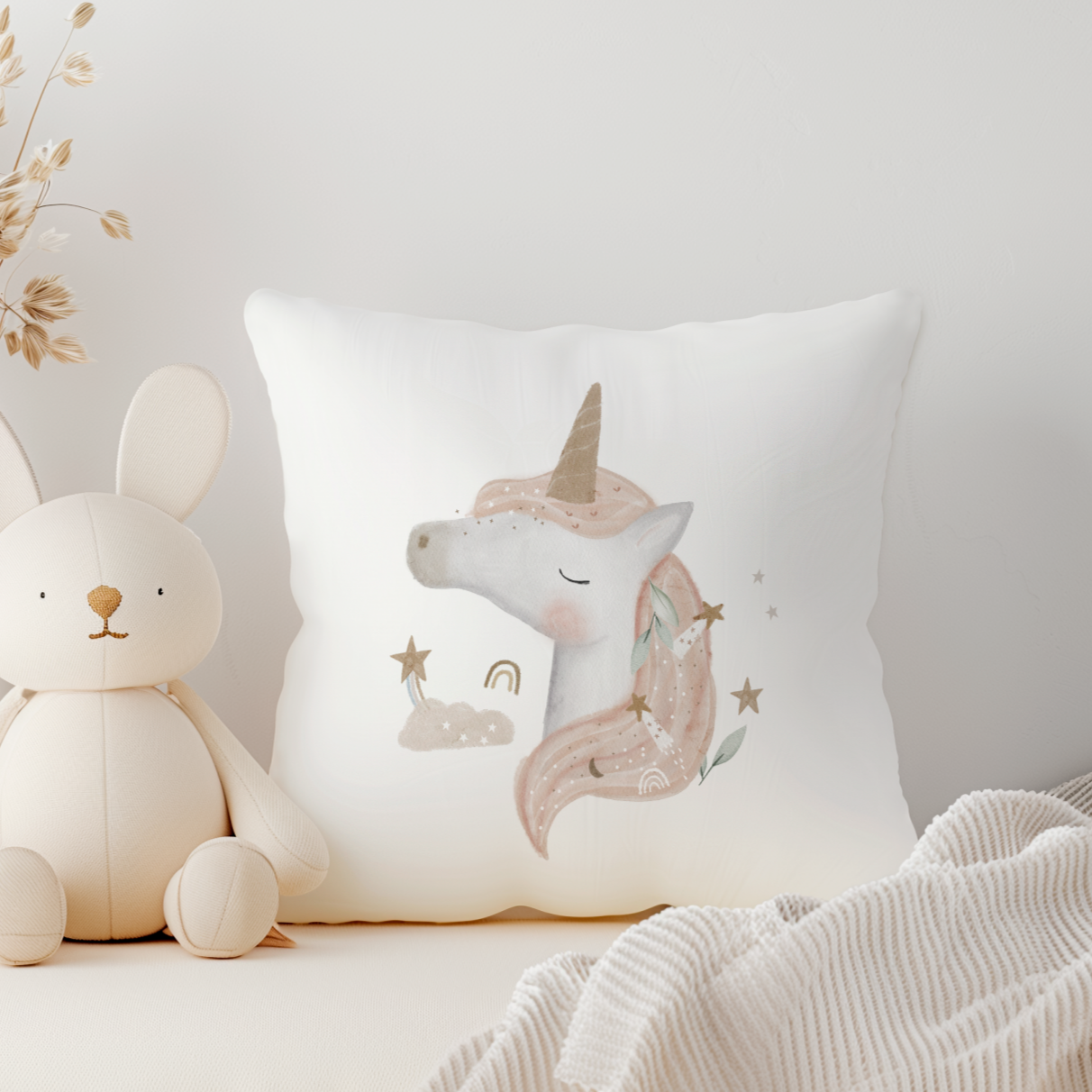 White canvas pillow with pink unicorn on