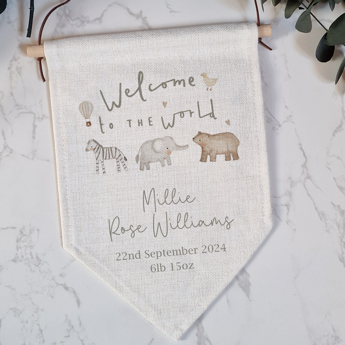 Welcome to the World linen like flag. Personalised with birth name and date in grey/green font.