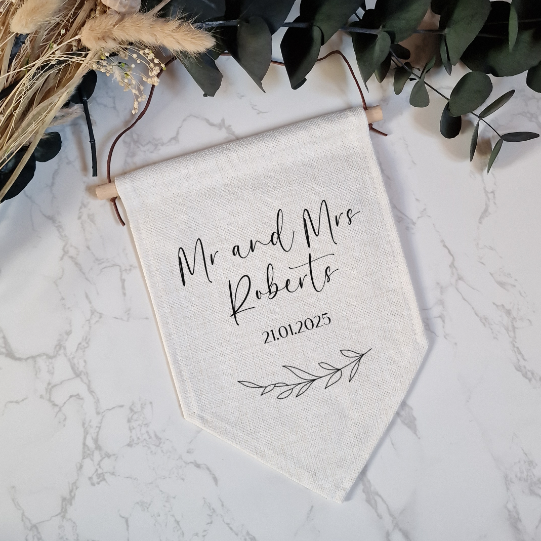 pennant flag for mr and mrs gift with wedding date and laurel leaf decorative element underneath