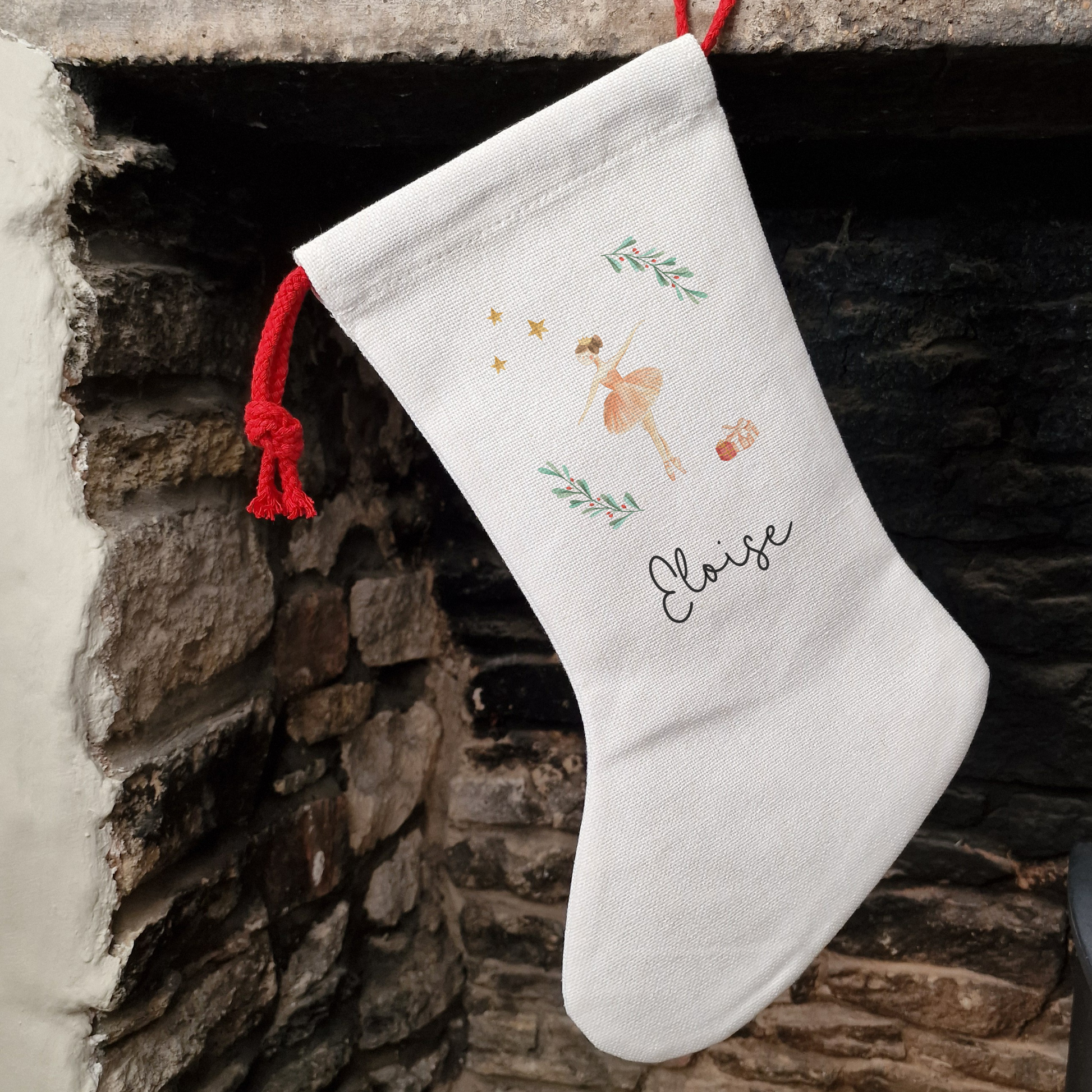 Off white linen-like stocking with Sugar Plum Fairy personalised with name in black script font.