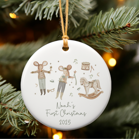 Christmas ornament with illustrations of Christmas Mice, rocking horse on a tree branch.