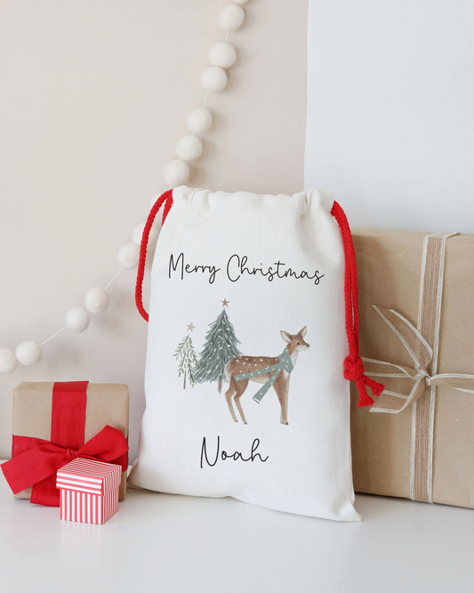 Decorative Christmas sack with a deer illustration and 'Merry Christmas Noah' text, surrounded by gift boxes.