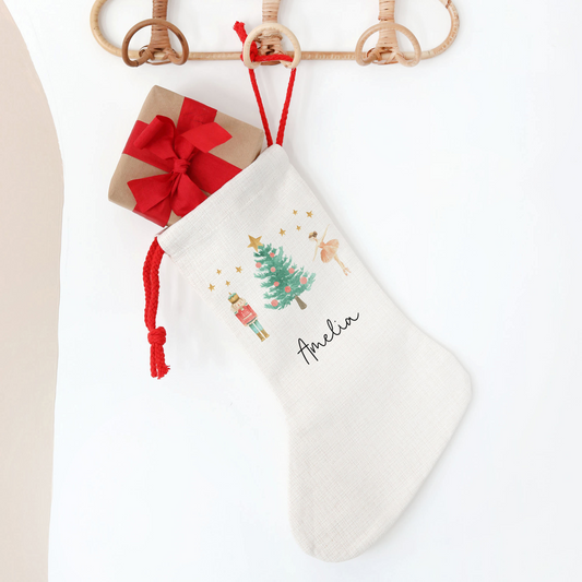 Off white linen stocking with nutcracker and sugar plum fairy design
