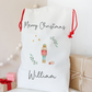 White Christmas stocking with 'Merry Christmas' and 'William' text, surrounded by festive decorations.