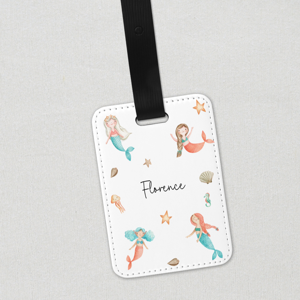 white tag with mermaid design with black strap