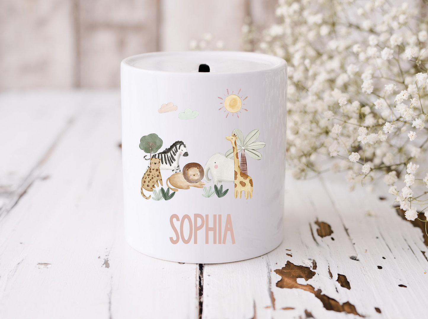 White ceramic money box with coin slot. Cute jungle safari illustration, personalised with name. 