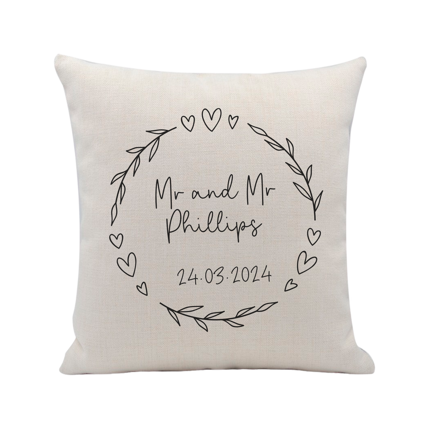 A linen beige cushion cover personalised with wedding name of mr and mrs including date, with heart and leaf decorative wreath