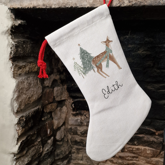 Reindeer Christmas Stocking in an off white linen-like material. Personalised with name in black script font.