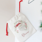Decorative pouch with a festive design and name 'Oliver' on a light background
