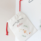 Personalized gift bag with text and graphics on a light background