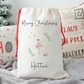 Off white linen like santa sack with sugar plum fairy illustration. Personalised with name.