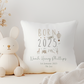 White cushion cover with Born in 2025 text. Jungle Safari Animals illustration. Personalised with name, birth date and birth weight in green font.