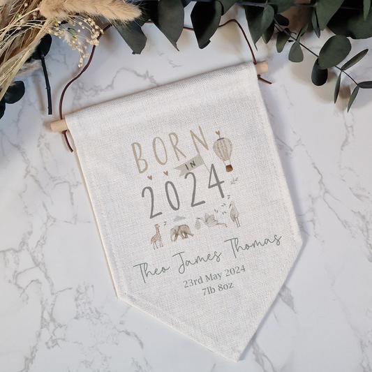 Linen flag with Born in 2024 text and safari animals. Personalised with name and birth details.