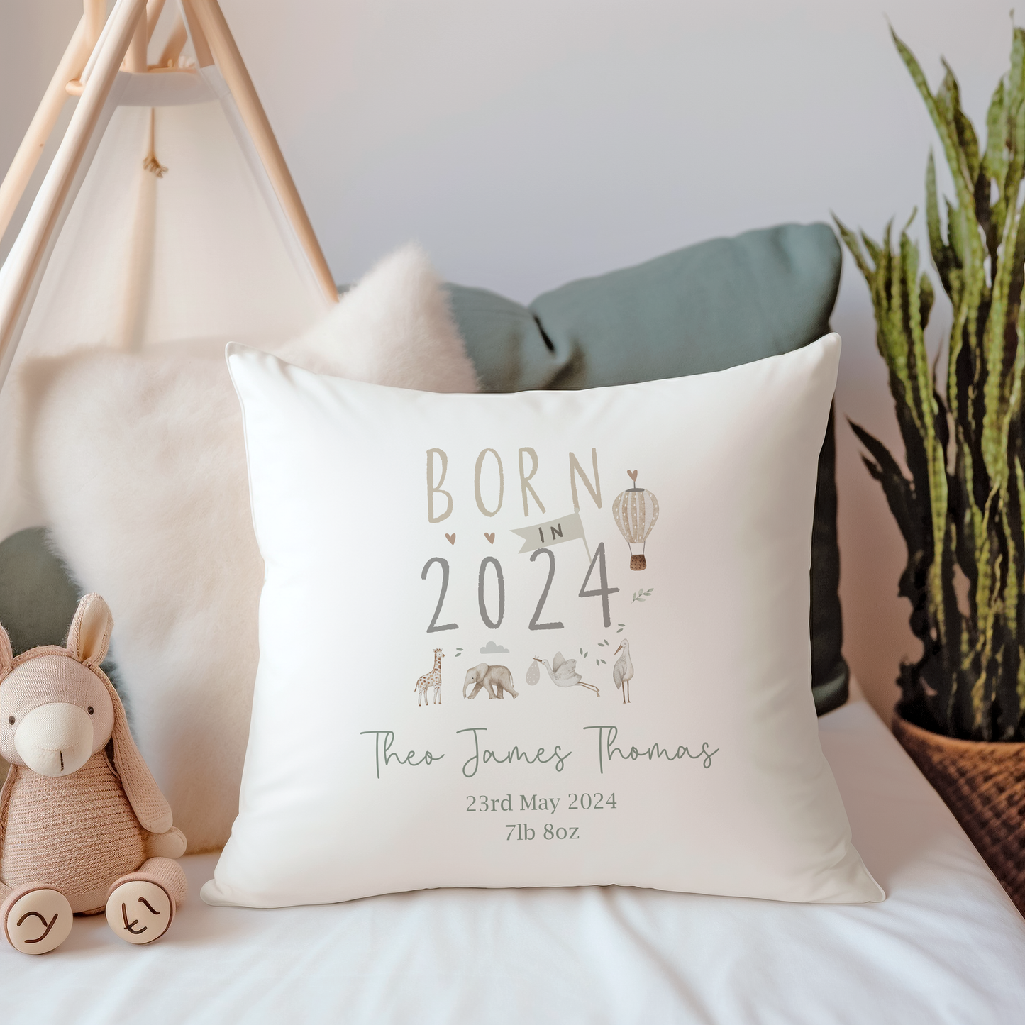 Canvas cushion cover with Born in 2024 text, personalised with name. Safari Animals and Hot Air Balloon illustration.