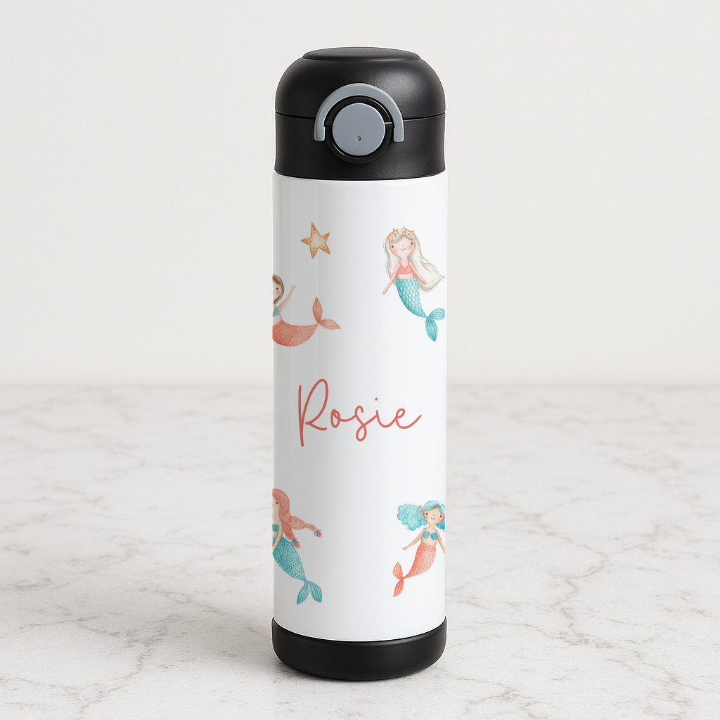Stainless steel bottle with mermaid design and personalised with name, placed on a marble surface