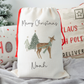 Off white linen santa sack with whimsical reindeer and christmas tree illustration. Personalised with name.