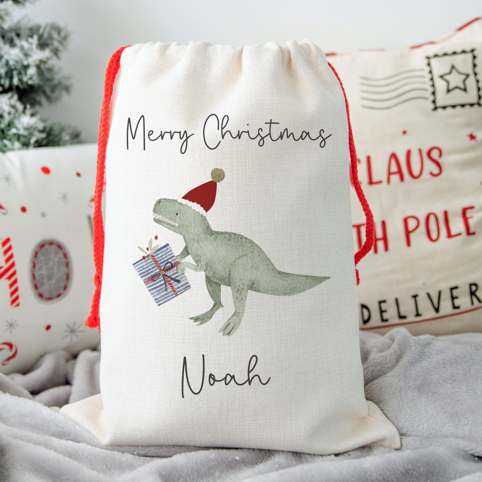 Off white linen-like Christmas sack with festive reindeer illustration. Personalised with name