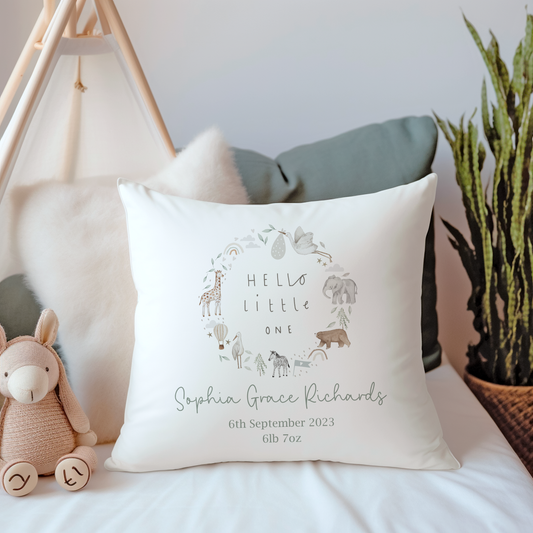 White canvas cushion cover with hello little one wreath and jungle safari animals. Personalised with name and birth details.