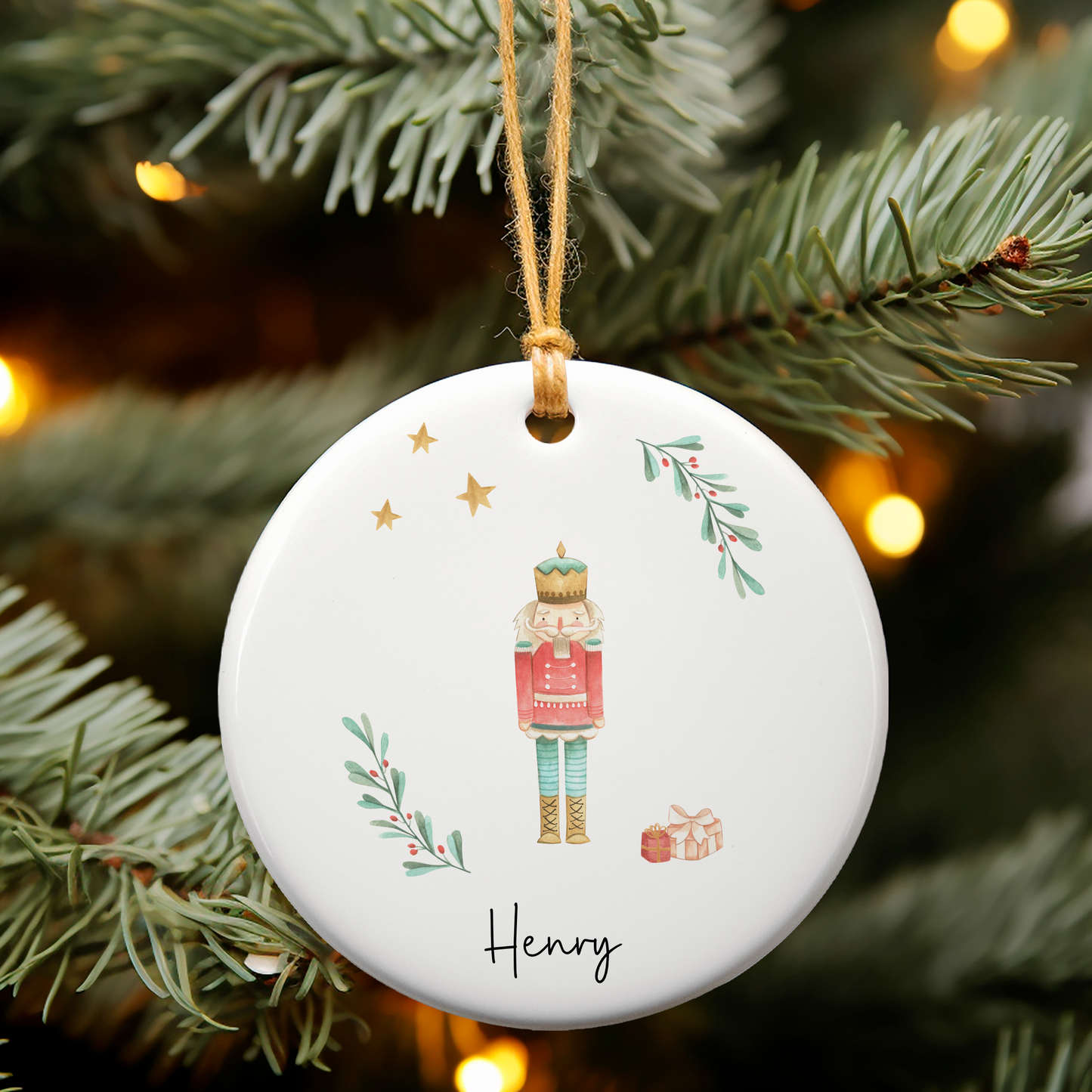 Ceramic ornament with Nutcracker  illustration. Personalised with name in black script font.