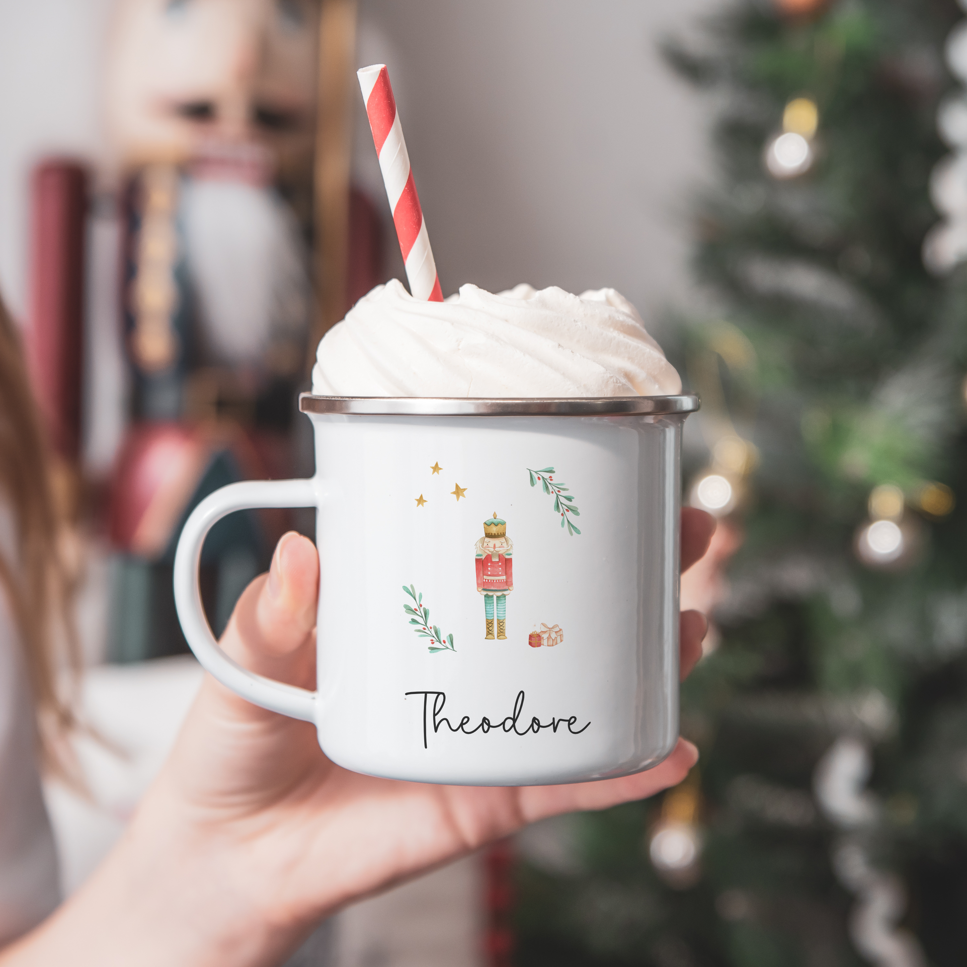 White camping mug with The Nutcracker illustration. Personalised with name in black font.