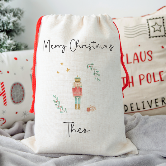 Off white linen like santa sack with The Nutcracker illustration. Personalised with name.