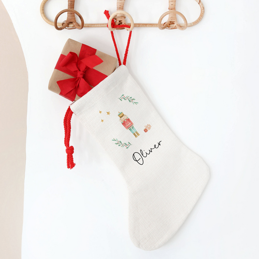 White Christmas stocking with Nutcracker design on a white background