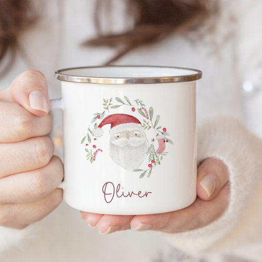 Person holding a mug with a Christmas-themed design and 'Oliver' text.