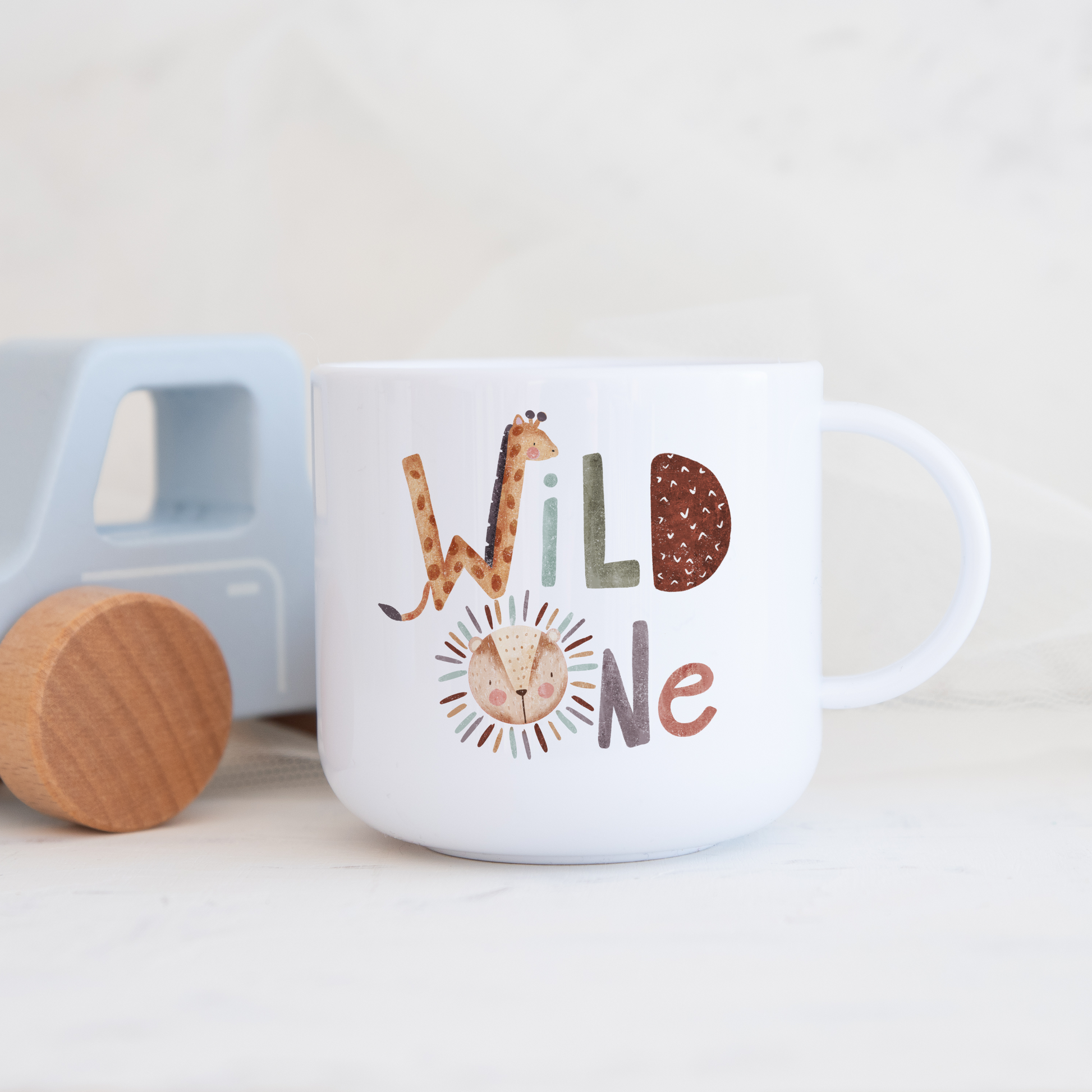 White polymer mug with wild one text incoporating cute giraffe and lion illustration