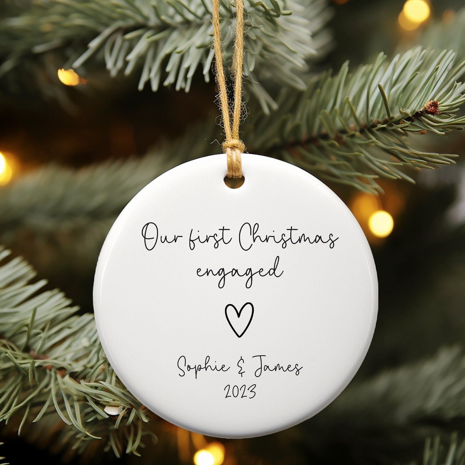 White ceramic ornament for first Christmas engaged personalised with name and year