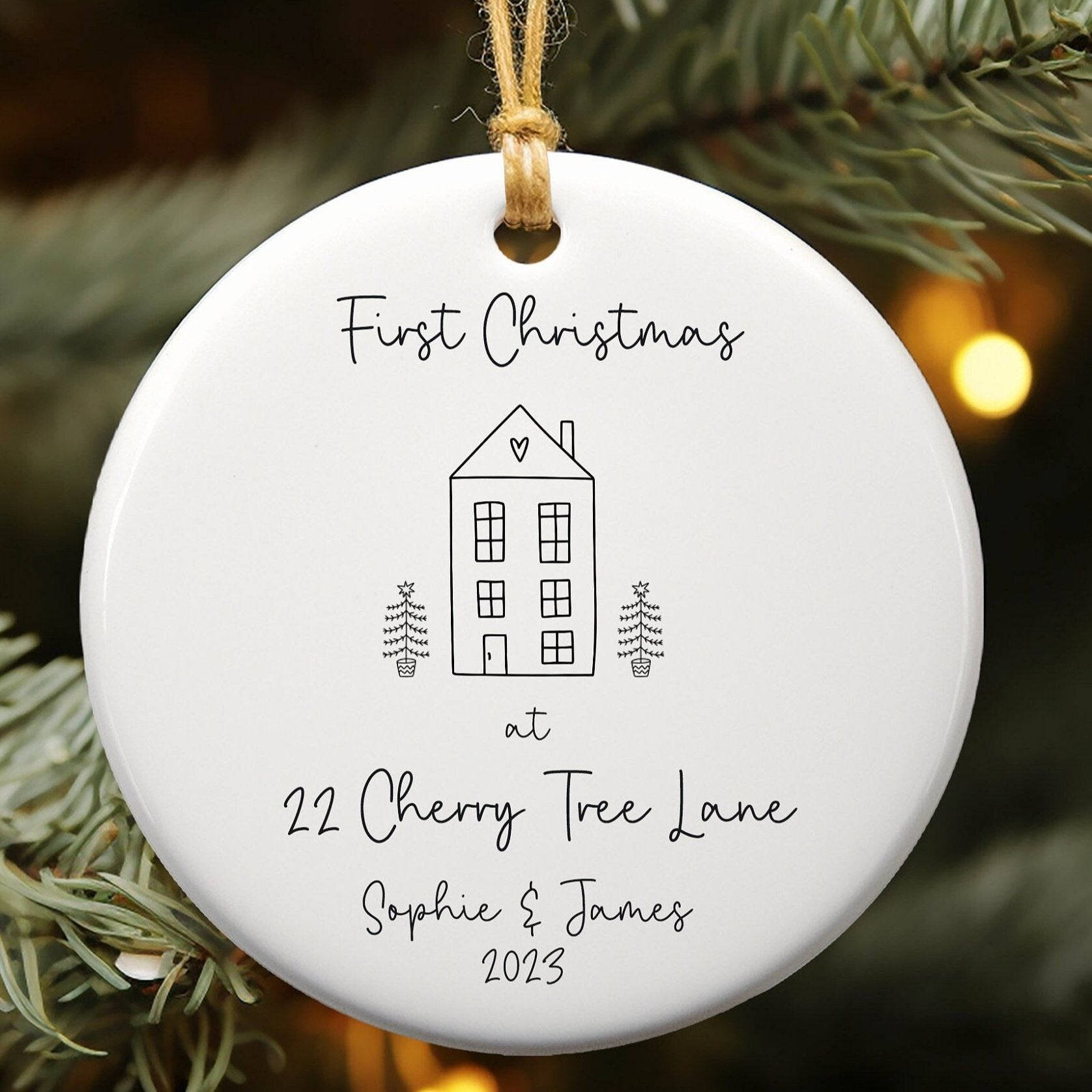 White ceramic ornament with cute house doodle for first Christmas in new home